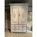 Tara Shaw 18th century Swedish Gustavian cabinet in distressed white paint with reeded diamond door carvings.