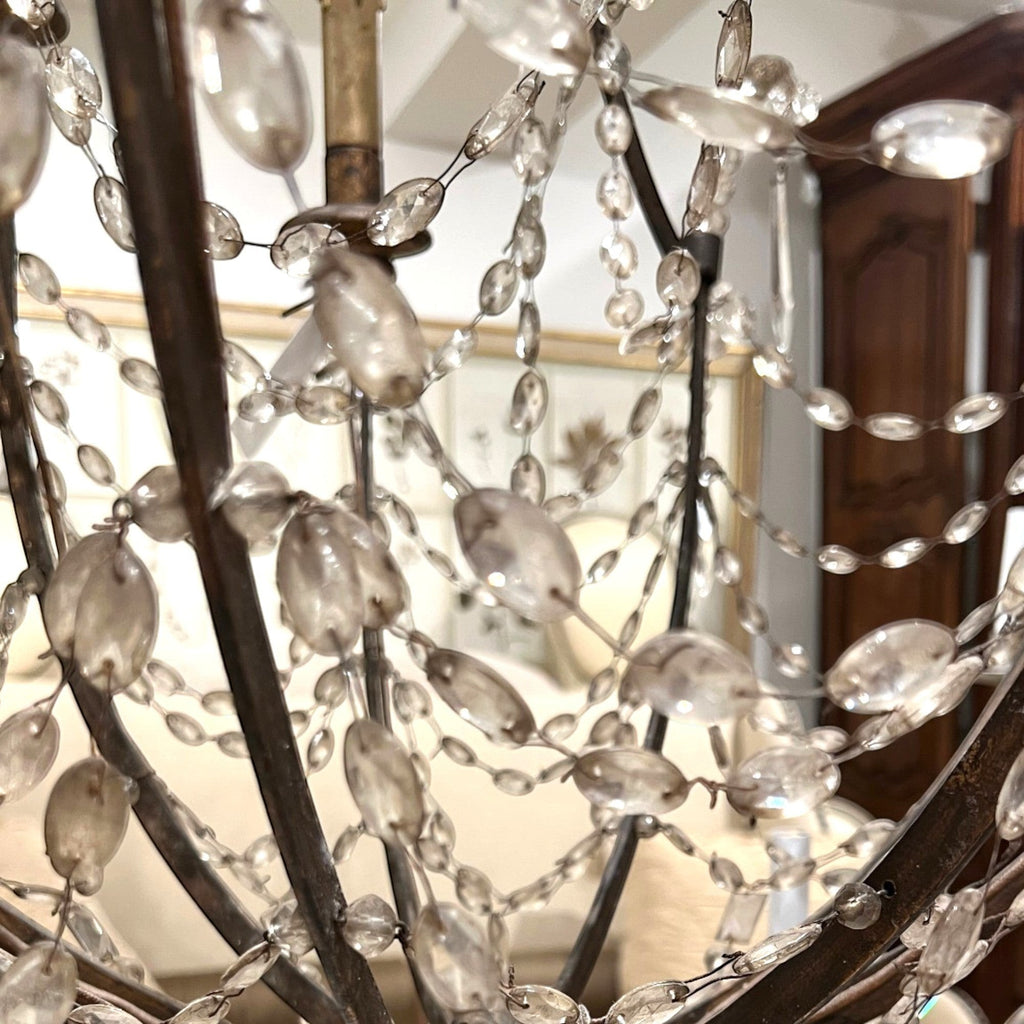 Tara Shaw 19th century Italian Empire chandelier with a giltwood and iron frame and draped crystal basket detail.