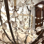 Tara Shaw 19th century Italian Empire chandelier with a giltwood and iron frame and draped crystal basket detail.