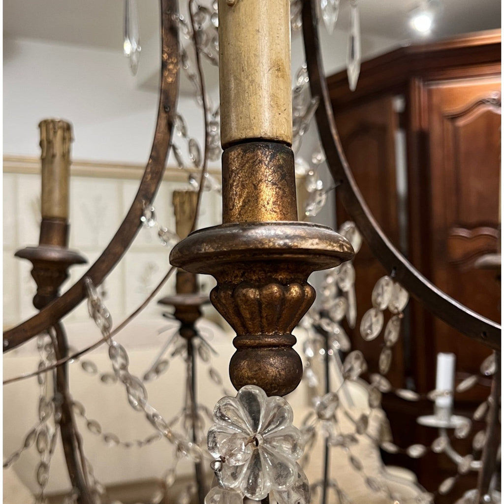Tara Shaw 19th century Italian Empire chandelier with giltwood, iron frame, and hanging crystal basket accents.