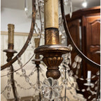 Tara Shaw 19th century Italian Empire chandelier with giltwood, iron frame, and hanging crystal basket accents.
