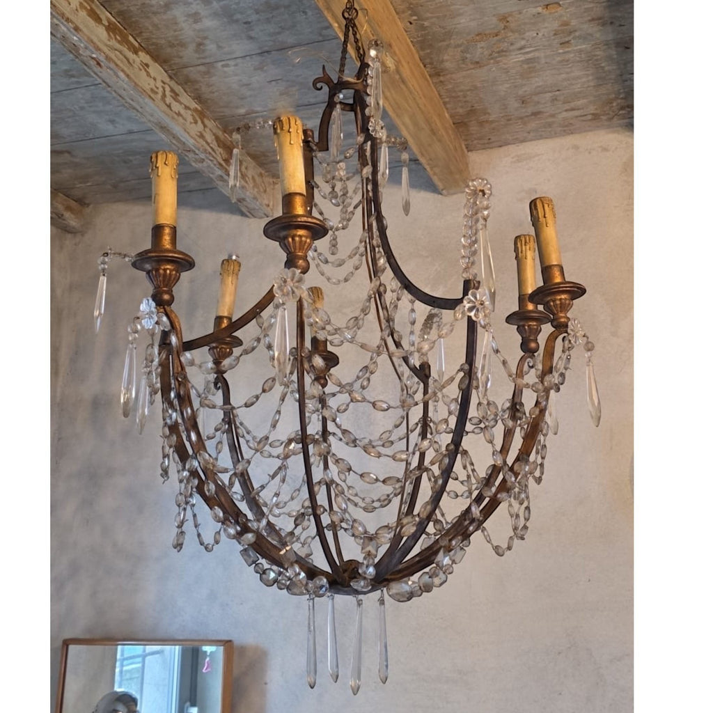 Tara Shaw 19th century Italian Empire chandelier with a giltwood and iron frame and draped crystal basket accents.