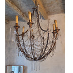 Tara Shaw 19th century Italian Empire chandelier with a giltwood and iron frame and draped crystal basket accents.