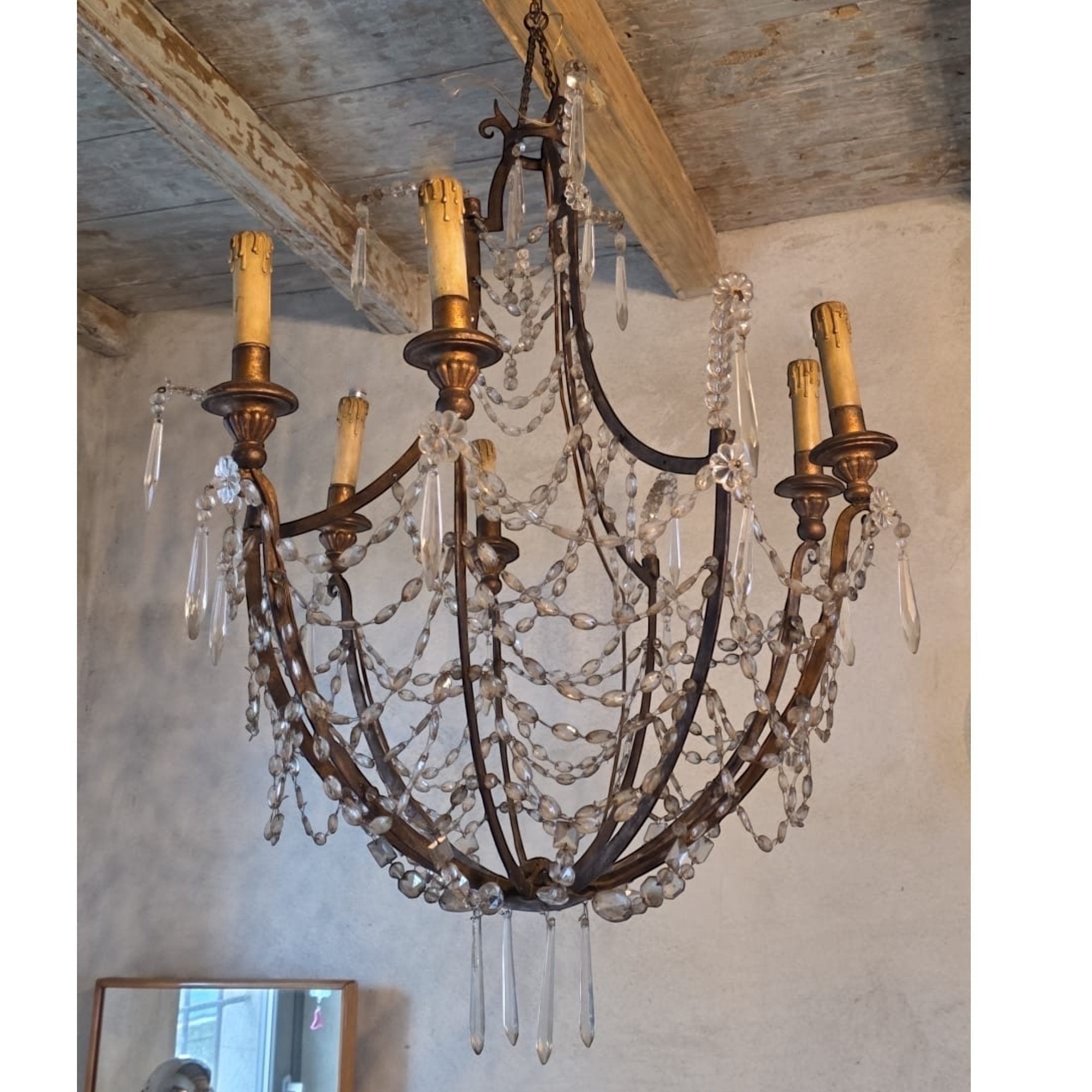 Tara Shaw 19th century Italian Empire chandelier with a giltwood and iron frame and draped crystal basket accents.
