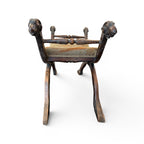 Tara Shaw 19th-century Italian walnut curule stool featuring carved ram's head finials and a classic crossed-leg base.