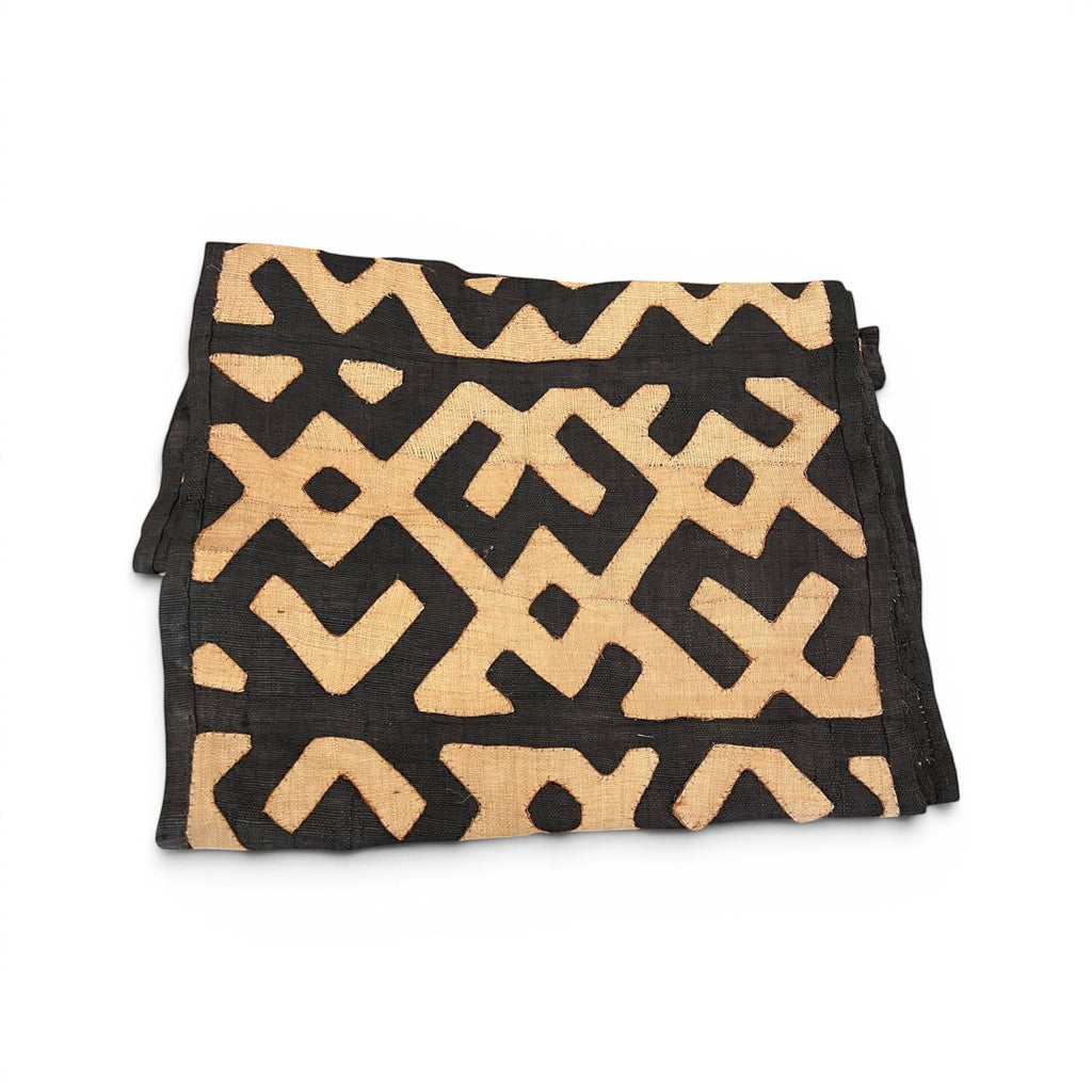 Tara Shaw authentic African Kuba cloth long runner featuring intricate black and tan geometric handwoven patterns.