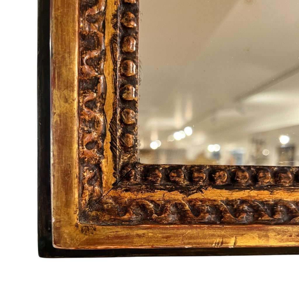 Tara Shaw 18th Century French Louis XVI mirror with a carved, aged gold patina frame and intricate detailing.