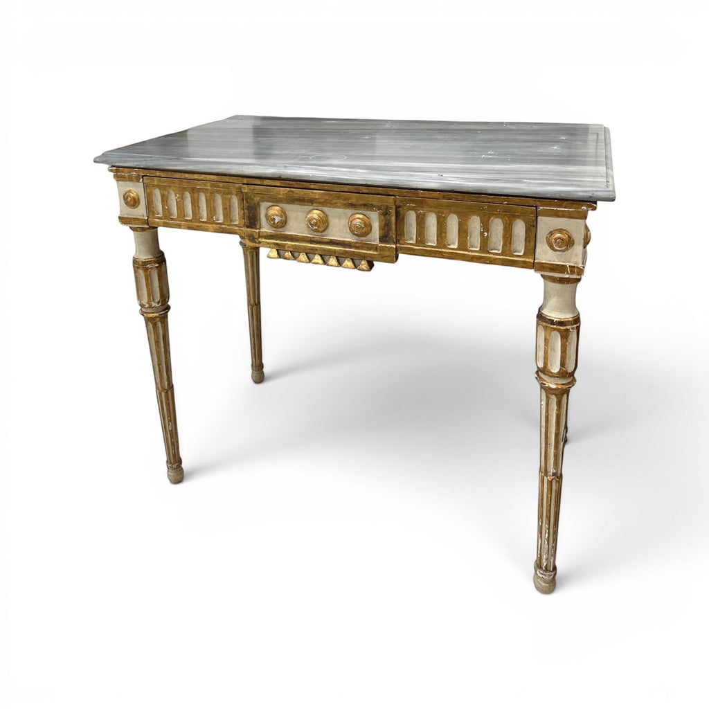 Tara Shaw 18th-century Italian Louis XVI console table with a grey marble top and distressed gold-painted wood finish.