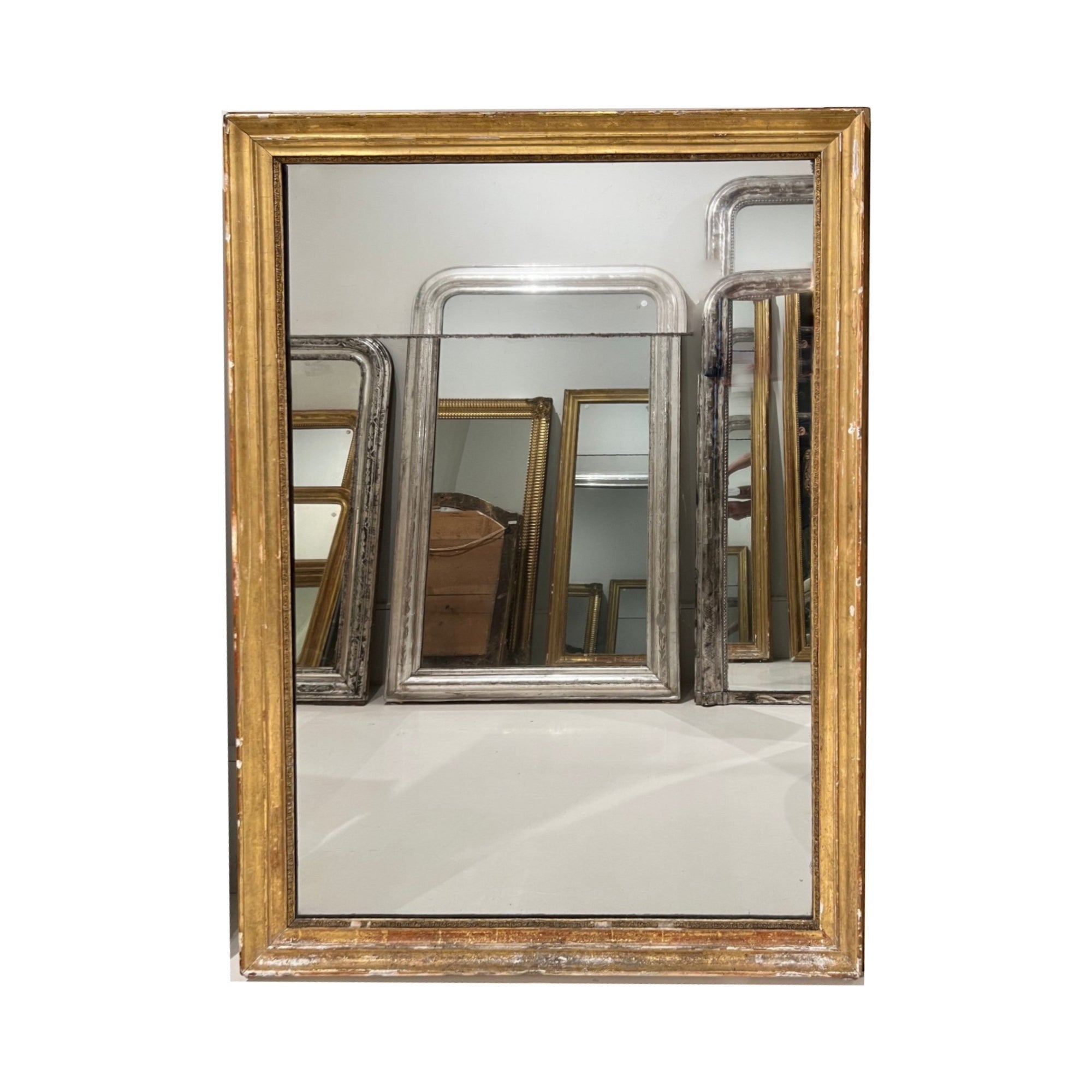 Tara Shaw 19th century French Louis XVI gilded mirror with neoclassical carved frame and elegant aged patina.