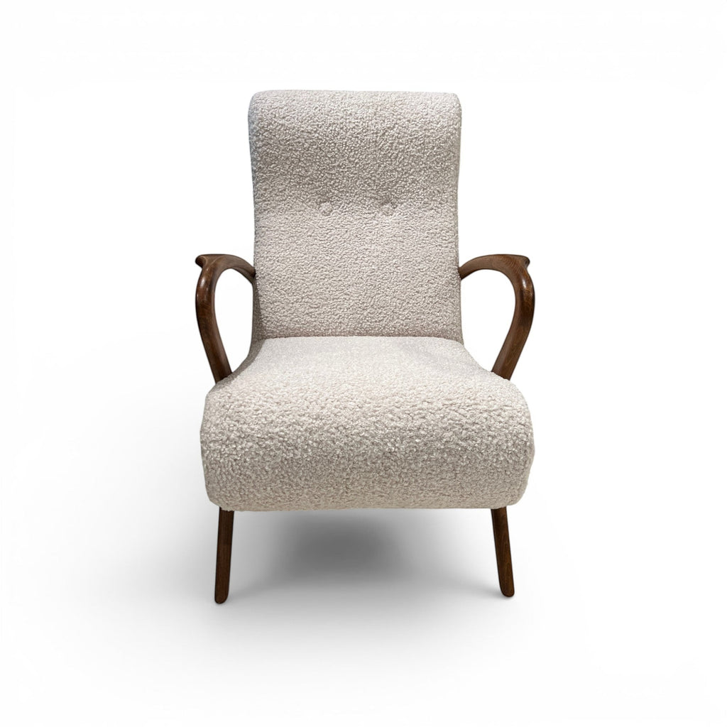Tara Shaw mid-century Italian chair with cream bouclé upholstery and dark wood curved arms and tapered legs