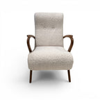 Tara Shaw mid-century Italian chair with cream bouclé upholstery and dark wood curved arms and tapered legs