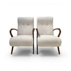 Tara Shaw pair of mid-century Italian chairs with cream bouclé upholstery and dark wood curved armrests