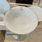 Tara Shaw French china bowl featuring a gold monogrammed B and elegant gold rim detailing on white porcelain.