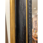 Tara Shaw 19th century French Napoleon III floor mirror with a detailed black and gilt frame