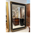 Tara Shaw 19th century French Napoleon III floor mirror with a black and gilt frame and ornate corner detailing.