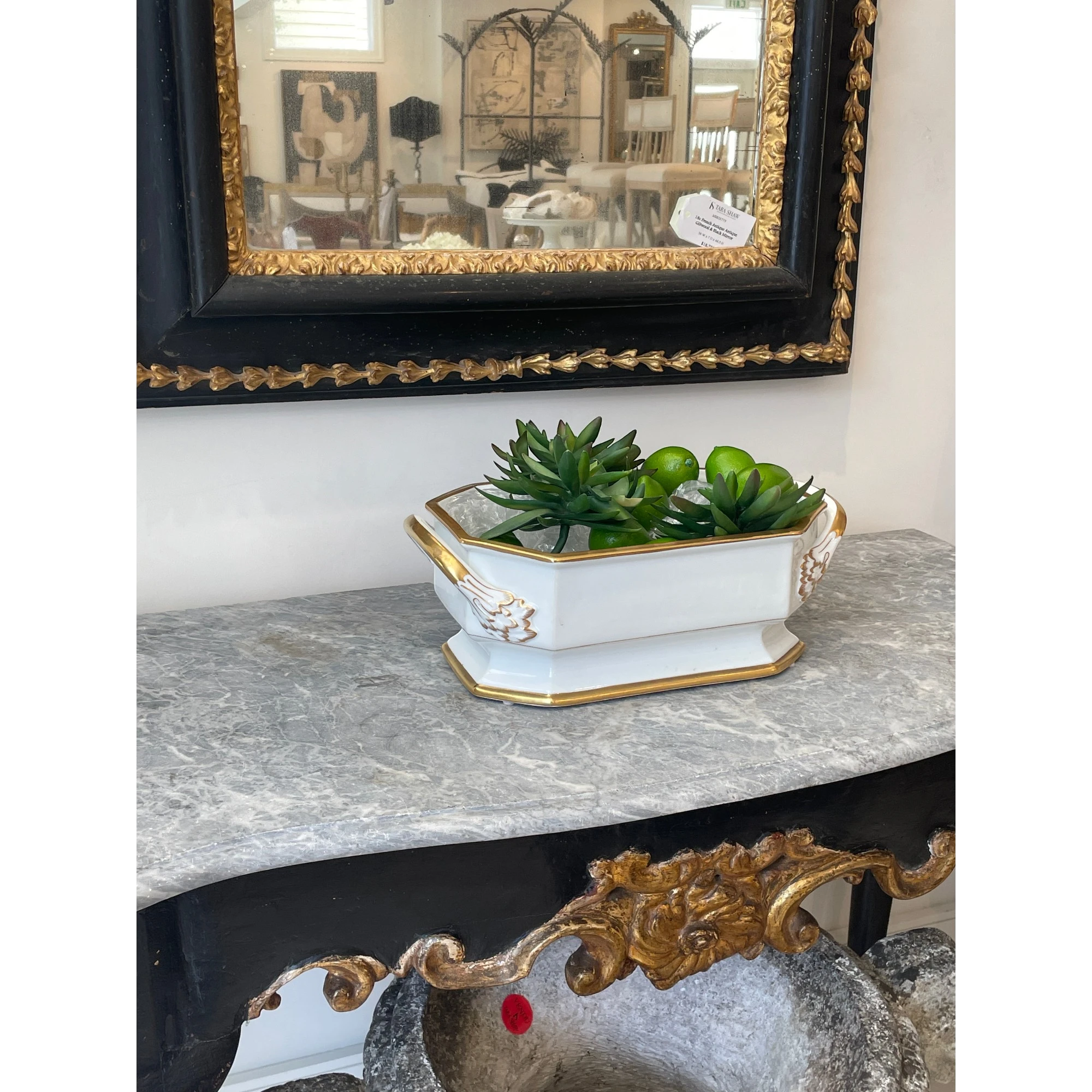Tara Shaw 19th century European white porcelain jardiniere with gold gilt accents on a marble console table.