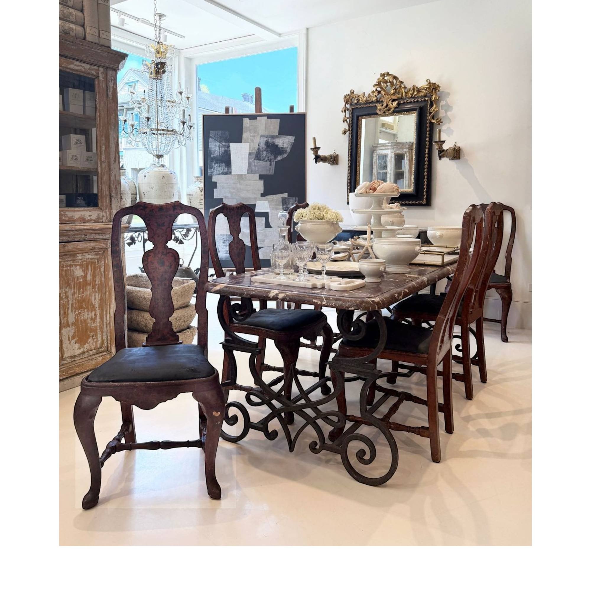 Tara Shaw set of six 18th-century Rococo dining chairs from Lucca with carved wooden frames and dark upholstered seats.