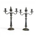 Tara Shaw pair of silver-plated double candlesticks featuring elegant fluted columns and decorative articulating swags.