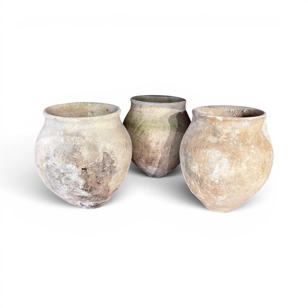 Tara Shaw set of three 18th century Spanish handcrafted pottery jars with rustic timeworn patina and unique textures.