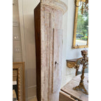 Tara Shaw 18th century Swedish Baroque corner cabinet in solid wood with a distressed white patina and curved door.