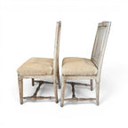 Tara Shaw pair of 18th-century Swedish chairs with distressed white paint, carved wood, and natural linen upholstery.