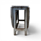Tara Shaw 19th-century Swedish drop leaf table with a distressed grey painted finish and hinged sides.