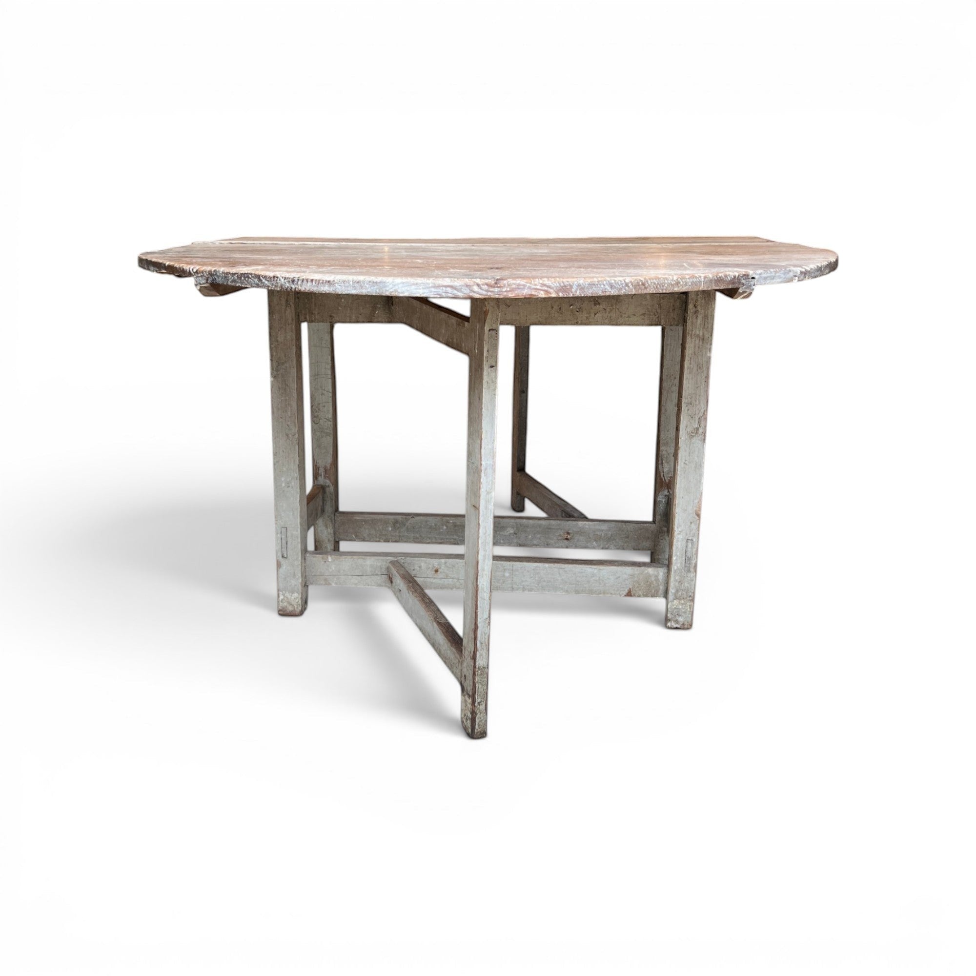 Tara Shaw 19th-century Swedish drop leaf table with a distressed grey painted finish and timeworn wooden surface.