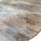 Tara Shaw 19th-century Swedish drop leaf table surface with a distressed grey painted finish and wood grain texture.