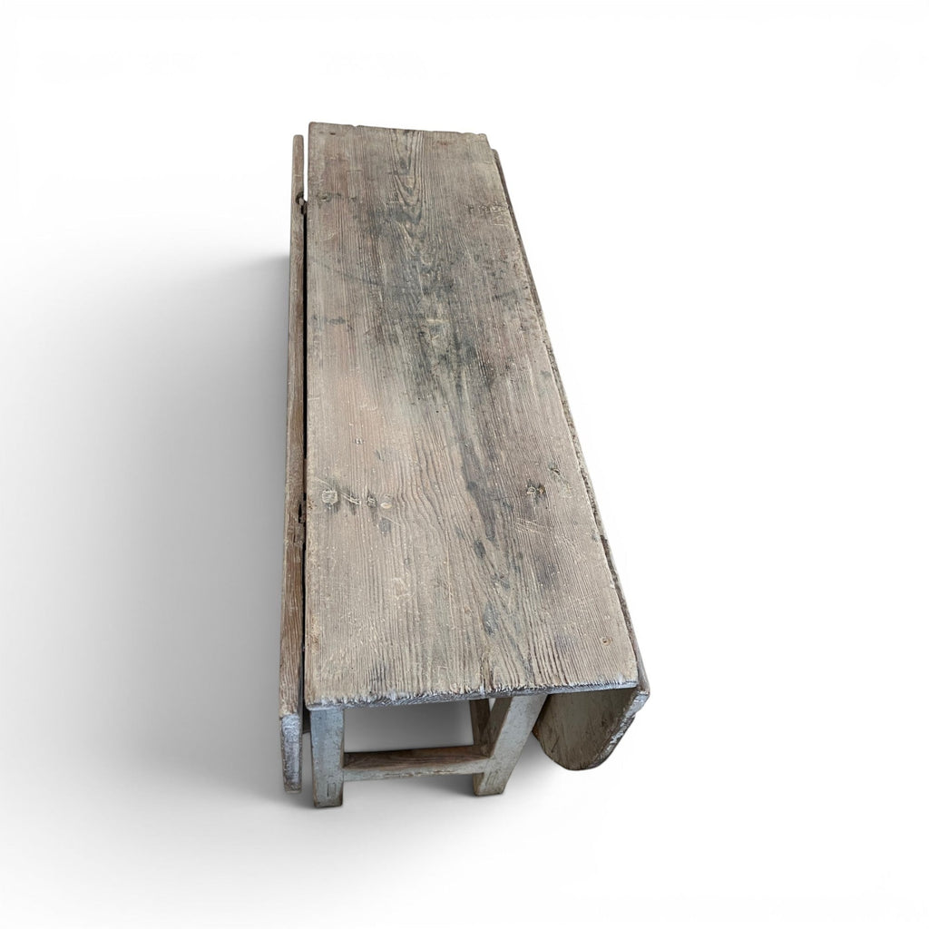 Tara Shaw 19th-century Swedish drop leaf table with a distressed grey painted finish and timeworn wood texture.