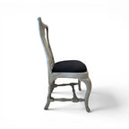 Tara Shaw 18th century Swedish Rococo dining chair with aged grey wood finish and black upholstered seat, side view.