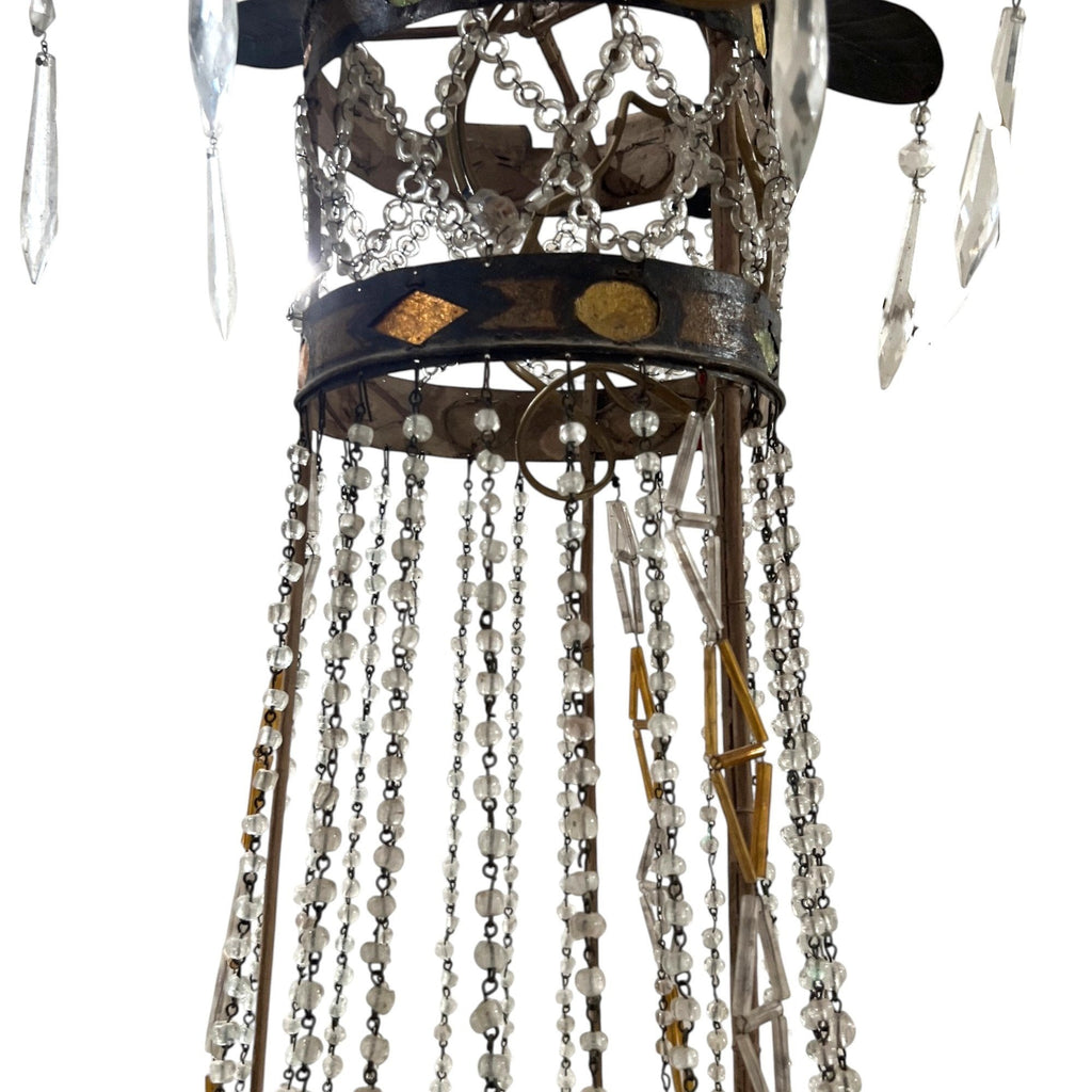 Tara Shaw 18th century Tuscan Empire chandelier with aged iron frame, neoclassical details, and crystal bead strands.