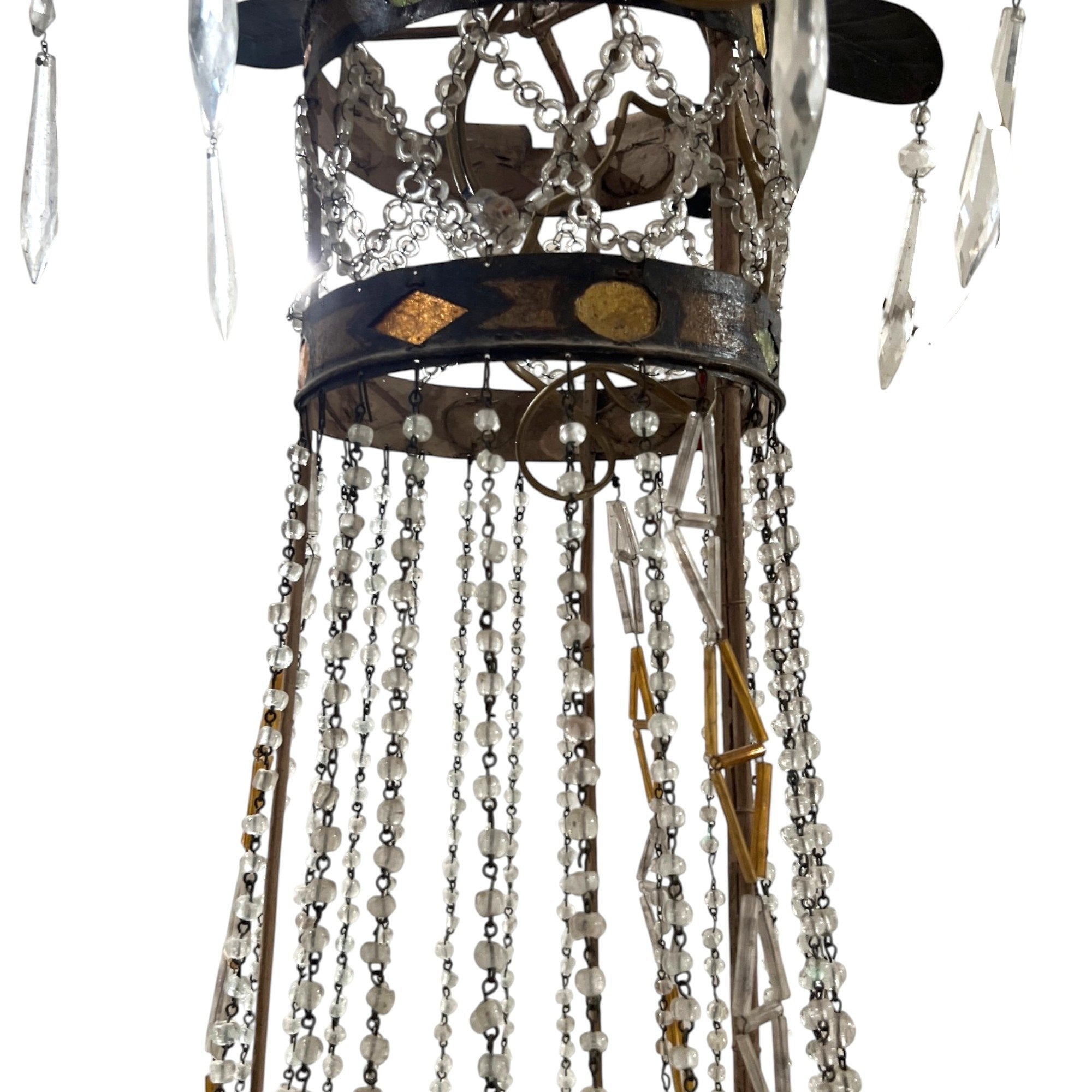 Tara Shaw 18th century Tuscan Empire chandelier with aged iron frame, neoclassical details, and crystal bead strands.