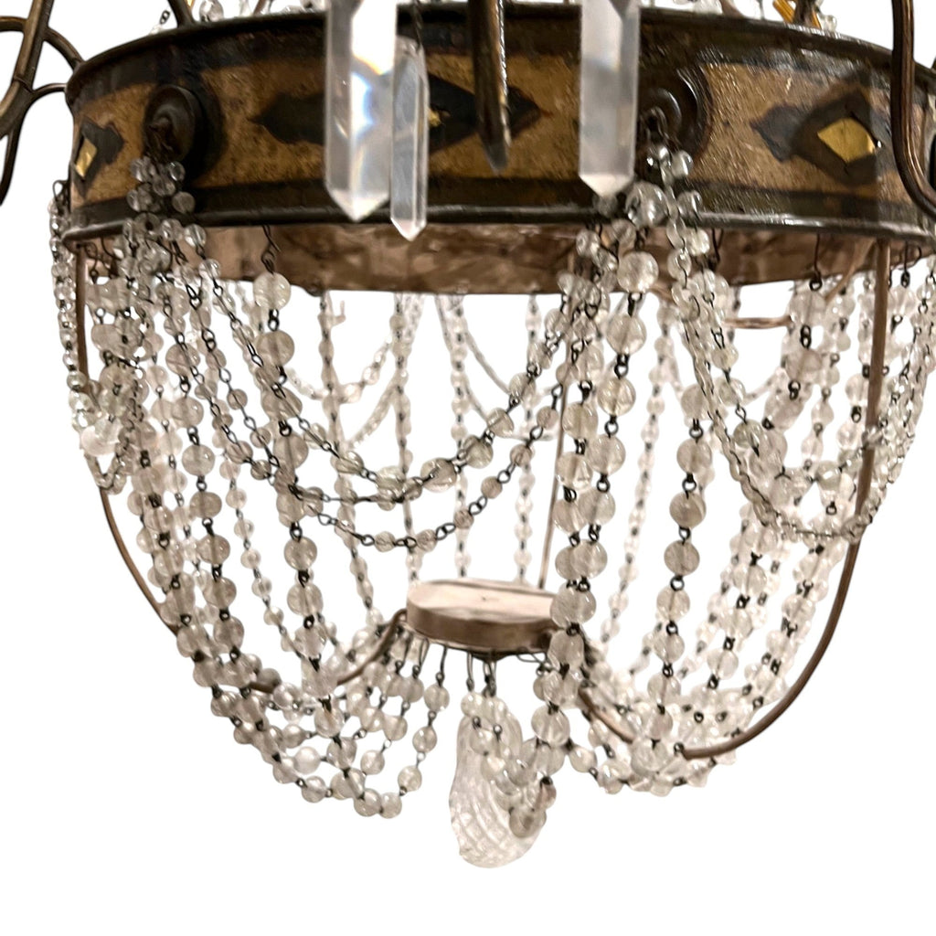 Tara Shaw 18th century Tuscan Empire chandelier with an aged iron frame, neoclassical details, and crystal beads.