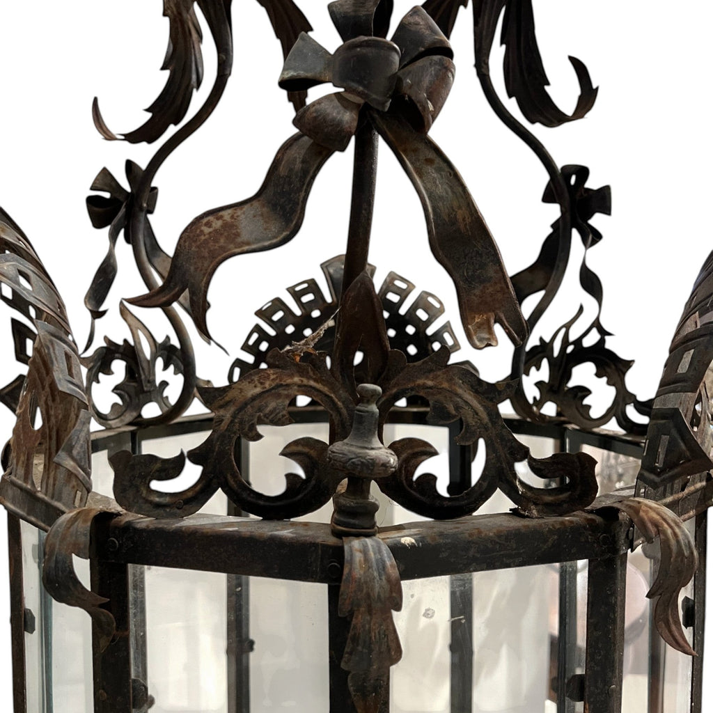 Tara Shaw mid-century Venetian lantern with intricate metalwork, ribbon details, and a warm aged patina finish.