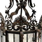 Tara Shaw mid-century Venetian lantern with intricate metalwork, ribbon details, and a warm aged patina finish.
